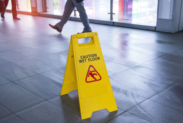 Caution wet floor sign on ground