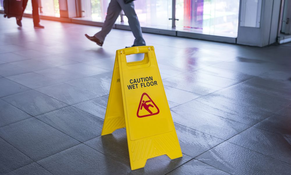 Caution wet floor sign on ground
