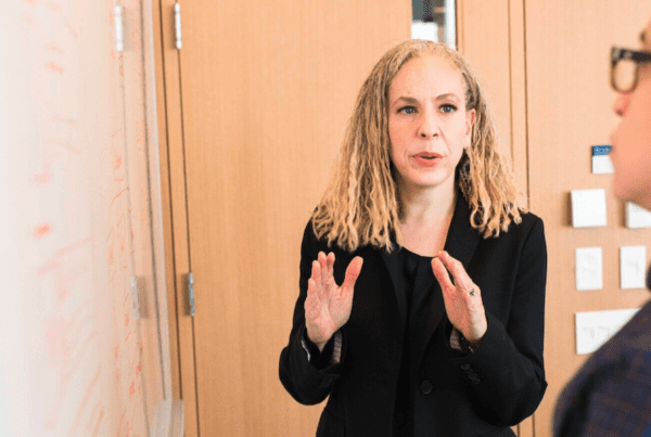 Spectrum Insurance Group Attracts and Keeps Business Clients With a Full-Spectrum Offering blog - woman explaining to man