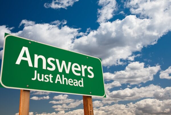 Health Plan of Wisconsin Offering Free Answer Centers - Roadsign infront of a blue sky with the text 'Answers Just Ahead'